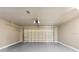 Empty garage featuring neutral paint, smooth floor, and overhead lighting at 6509 W Longboat Blvd, Tampa, FL 33615
