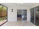 The screened lanai offers views of the kitchen and the pool in the back yard at 6509 W Longboat Blvd, Tampa, FL 33615