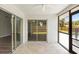 Covered lanai with tile flooring and access to the living area and fenced backyard at 6509 W Longboat Blvd, Tampa, FL 33615