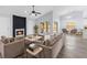 Spacious living room with a fireplace, modern decor, and sliding doors leading to an outdoor space at 6509 W Longboat Blvd, Tampa, FL 33615