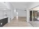Spacious living area with vaulted ceiling, wood floors, and sliding glass doors to the lanai at 6509 W Longboat Blvd, Tampa, FL 33615