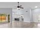 Open-concept living space with a sleek kitchen, ample natural light, and modern flooring at 6509 W Longboat Blvd, Tampa, FL 33615