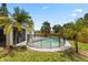Beautiful fenced pool with mature landscaping providing privacy at 6509 W Longboat Blvd, Tampa, FL 33615