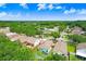 An aerial view of the neighborhood showcasing the community's proximity to a tranquil pond at 6801 Summer Cove Dr, Riverview, FL 33578