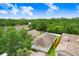This aerial view shows the property nestled amongst mature trees, offering privacy and shade at 6801 Summer Cove Dr, Riverview, FL 33578