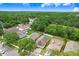 Aerial view of a neighborhood with mature trees and well-maintained lawns at 6801 Summer Cove Dr, Riverview, FL 33578