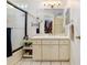 Bright bathroom with a walk-in closet and modern vanity, maximizing space and functionality at 6801 Summer Cove Dr, Riverview, FL 33578