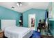 Cozy bedroom with blue walls, ceiling fan, and a closet at 6801 Summer Cove Dr, Riverview, FL 33578