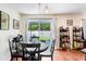 Cozy dining area with sliding glass doors to the backyard, providing natural light and outdoor access at 6801 Summer Cove Dr, Riverview, FL 33578