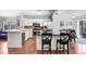 Modern kitchen with white cabinetry, stainless steel appliances, and a center island with barstool seating at 6801 Summer Cove Dr, Riverview, FL 33578