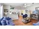 Bright living room with hardwood floors, ceiling fan, and an open concept design at 6801 Summer Cove Dr, Riverview, FL 33578