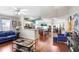 Bright living room with hardwood floors, ceiling fan, and open concept design at 6801 Summer Cove Dr, Riverview, FL 33578