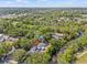 An aerial view of a home with a lush green surrounding and a river at 6807 River Rd, Tampa, FL 33615