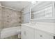 This bathroom features a newly renovated vanity, a shower-tub combination, and modern fixtures at 6807 River Rd, Tampa, FL 33615