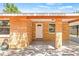The home's entrance features a stylish portico and is well lit with colorful decorative concrete at 6807 River Rd, Tampa, FL 33615