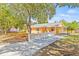 Beautifully renovated home with a new driveway and lush landscaping, offering great curb appeal at 6807 River Rd, Tampa, FL 33615