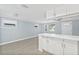 Open-concept living room with a breakfast bar dividing the kitchen at 6807 River Rd, Tampa, FL 33615