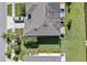 Aerial view of the home's roof, backyard, and the surrounding landscaping at 7916 Evergreen Creek Ct, Riverview, FL 33578