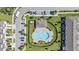 Community pool featuring a large patio and landscaping in this aerial shot at 7916 Evergreen Creek Ct, Riverview, FL 33578