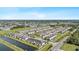 Expansive aerial view of a serene community with water features and lush surroundings at 7916 Evergreen Creek Ct, Riverview, FL 33578