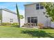 Private backyard featuring a well-manicured lawn, patio area, and privacy fence at 7916 Evergreen Creek Ct, Riverview, FL 33578