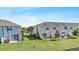 Scenic backyard featuring a lush lawn, lovely patio, and peaceful green space at 7916 Evergreen Creek Ct, Riverview, FL 33578