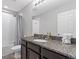 Modern bathroom with granite countertops, vanity, and a shower-tub combination at 7916 Evergreen Creek Ct, Riverview, FL 33578