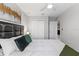 Cozy bedroom featuring a large bed, soft bedding, closet and stylish decor at 7916 Evergreen Creek Ct, Riverview, FL 33578
