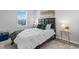 Comfortable bedroom with a well-made bed and stylish decor at 7916 Evergreen Creek Ct, Riverview, FL 33578