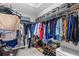 Organized walk-in closet with ample storage, shelves, and hanging space at 7916 Evergreen Creek Ct, Riverview, FL 33578