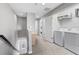Bright upstairs hallway featuring laundry area and access to bedrooms and bathrooms at 7916 Evergreen Creek Ct, Riverview, FL 33578