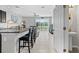 Spacious kitchen and dining area featuring an island with bar seating and an open layout at 7916 Evergreen Creek Ct, Riverview, FL 33578