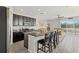 Modern kitchen with stainless steel appliances, dark cabinets, and granite countertops at 7916 Evergreen Creek Ct, Riverview, FL 33578