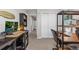 Bright home office with dual work stations, neutral walls, and comfortable office chairs at 7916 Evergreen Creek Ct, Riverview, FL 33578