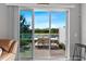 Relaxing patio with outdoor seating overlooking a serene lake and lush greenery at 7916 Evergreen Creek Ct, Riverview, FL 33578