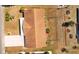 Aerial view showcasing a residential property featuring a well-maintained lawn, mature landscaping, and a long driveway at 828 Fox Hills Dr, Sun City Center, FL 33573