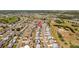 A sunny aerial view features a neighborhood with single-story homes and green spaces at 828 Fox Hills Dr, Sun City Center, FL 33573