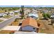 Aerial view showcasing a single-Gathering home with a well-kept lawn, long driveway, and proximity to a golf course at 828 Fox Hills Dr, Sun City Center, FL 33573