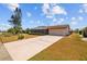 Charming single-story home with an attached garage and a long private driveway at 828 Fox Hills Dr, Sun City Center, FL 33573