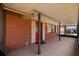 Inviting front entrance with brick siding, covered porch, and vibrant red front door at 828 Fox Hills Dr, Sun City Center, FL 33573