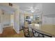 Open kitchen with breakfast bar seating, stainless steel appliances, and access to other rooms at 828 Fox Hills Dr, Sun City Center, FL 33573