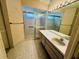 Bathroom with a shower stall, mirror, and cabinets at 8635 Braxton Dr, Hudson, FL 34667