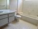 Bathroom featuring a tub, toilet, and vanity with sink at 8635 Braxton Dr, Hudson, FL 34667