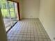 Spacious living room with tile flooring and sliding glass doors leading to the outside at 8635 Braxton Dr, Hudson, FL 34667