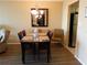 Bright dining room with hardwood floors and seating for four at 9 Forbes Pl # 310, Dunedin, FL 34698