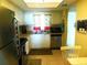 Fully-equipped kitchen with stainless steel appliances and tile flooring at 9 Forbes Pl # 310, Dunedin, FL 34698