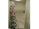 Bathroom shower with a tropical fish shower curtain and white tile walls at 9 Forbes Pl # 310, Dunedin, FL 34698