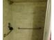 Close-up of a shower with safety bars and tile walls at 9 Forbes Pl # 310, Dunedin, FL 34698