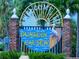 Welcome to the Dunedin Causeway sign with a charming pelican and lush greenery at 9 Forbes Pl # 310, Dunedin, FL 34698