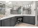 Elegant bathroom with double vanity sinks, marble countertops, and modern lighting at 9712 Tree Tops Lake Rd, Tampa, FL 33626